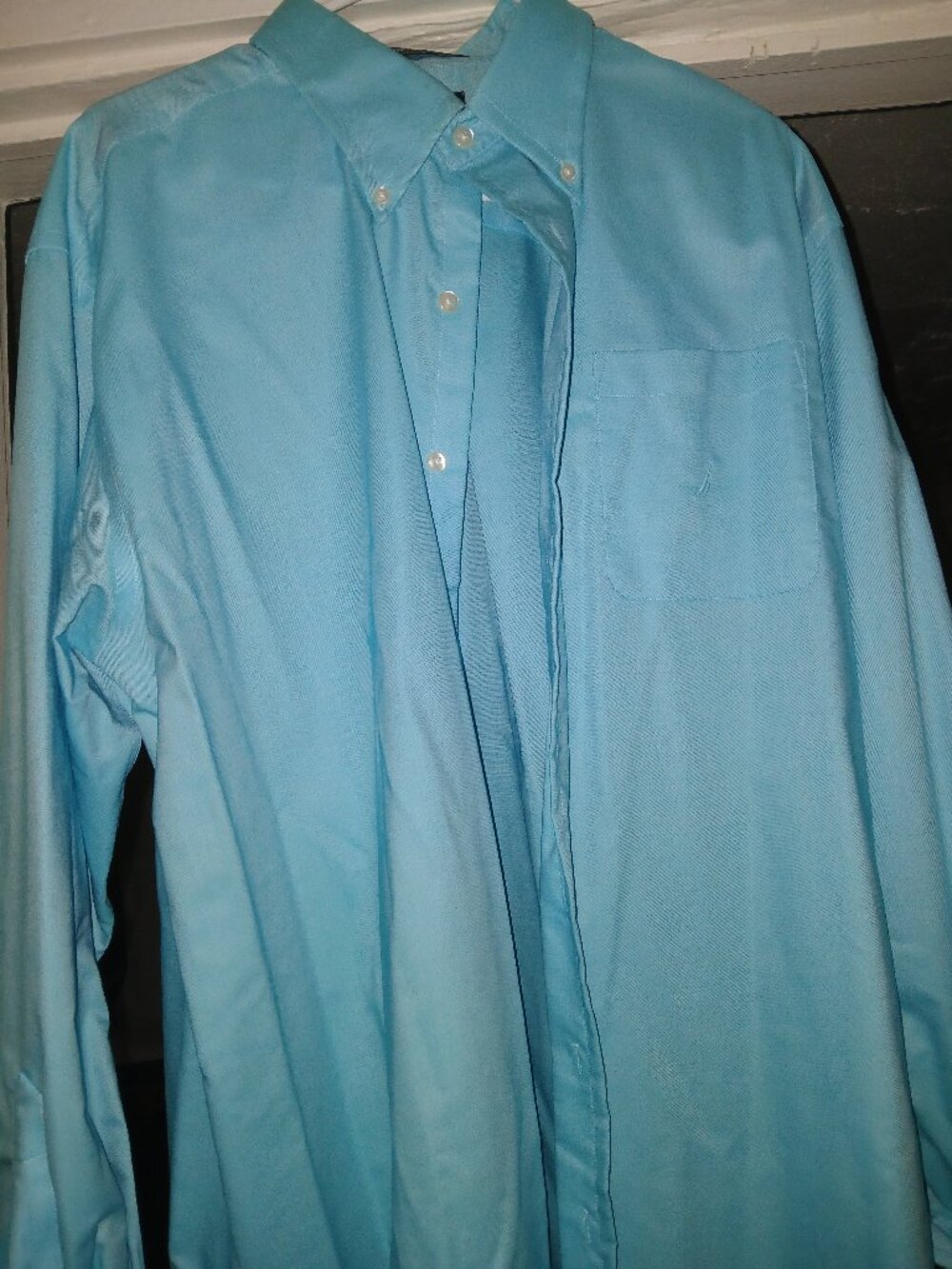 Nautica Blue Button Down Shirt, never worn. No outside designer markings.